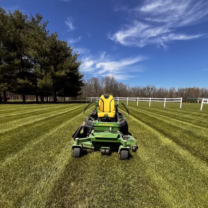 Mower on striped lawn